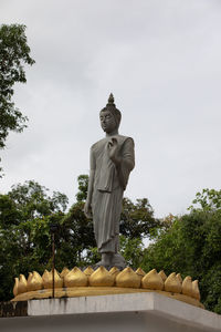 Low angle view of statue against sky