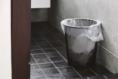 Dustbin on tiled floor