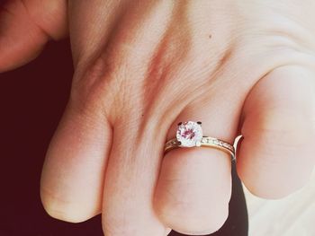 Cropped image of woman with diamond ring