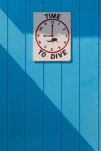 Close-up of clock on wall