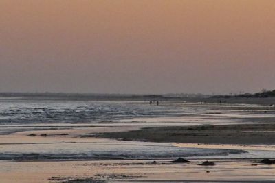 Scenic view of beach against clear sky