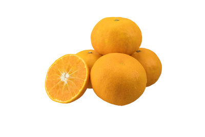 Close-up of oranges against white background