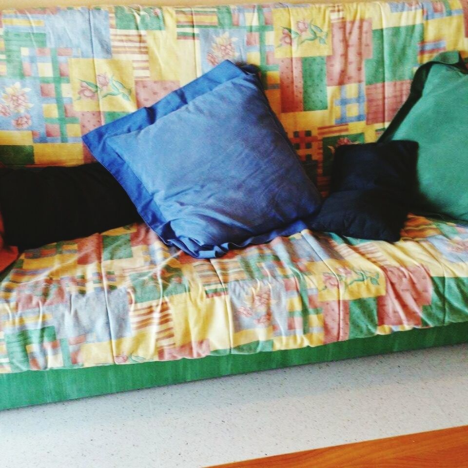 indoors, multi colored, fabric, textile, variation, clothing, bed, choice, art and craft, retail, sheet, for sale, sofa, pillow, blanket, material, creativity, no people, high angle view, colorful