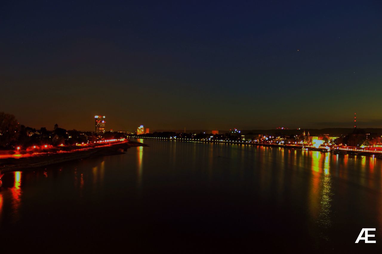 night, illuminated, reflection, water, river, bridge - man made structure, sky, built structure, waterfront, no people, architecture, connection, outdoors, tranquility, beauty in nature, city, building exterior, scenics, nature