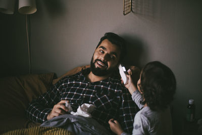 Young couple sitting at home