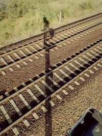 Shadow of person on railroad track