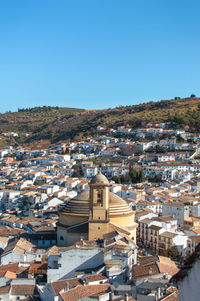 High angle view of townscape against clear blue sky