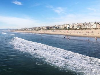 Scenic view of sea against blue sky