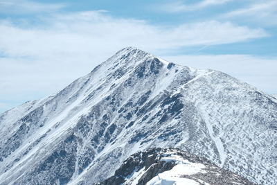 Scenic view of snowcapped mountain against sky