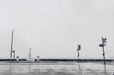 Windmills against clear sky during winter