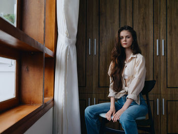 Portrait of young woman looking away