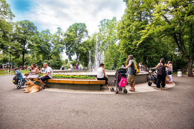 People sitting on bench in park