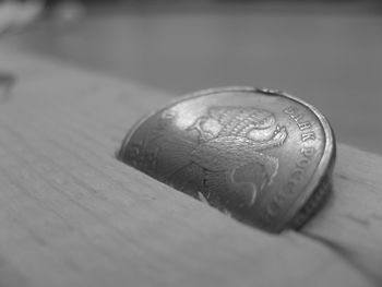 Close-up of coin on table