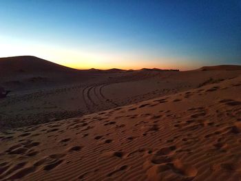 Scenic view of desert against clear sky