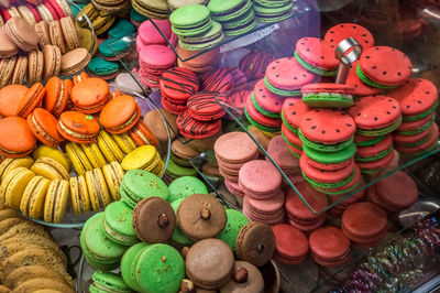 High angle view of colorful macaroons for sale in shop