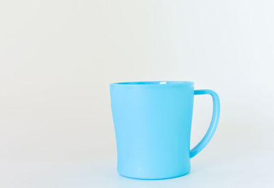 Close-up of coffee cup against white background