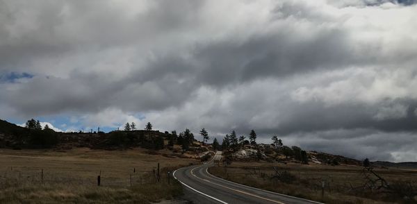 Panoramic view of road against cloudy sky