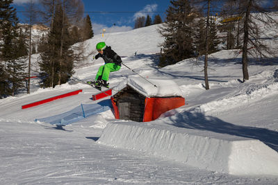 Person skiing on snow covered mountain