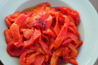 High angle view of chopped vegetables in plate on table