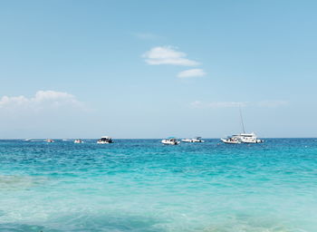 Sailboat in sea against sky