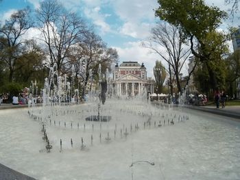 Built structure in park against sky in city