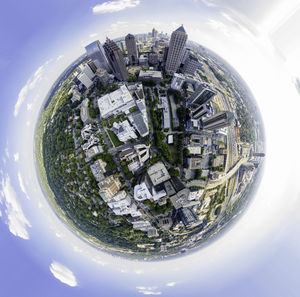 Digital composite image of buildings and trees against sky