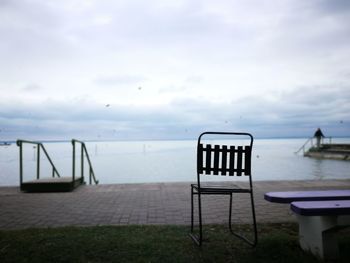 Lifeguard hut on sea against sky