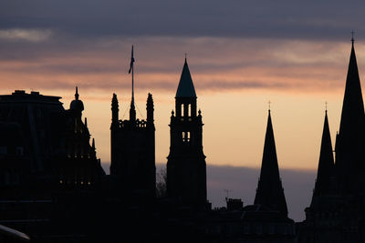 Silhouette of temple against sky during sunset