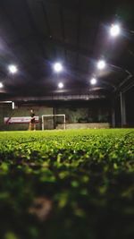 Group of people on soccer field at night