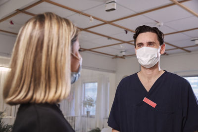Patient and doctor in protective face masks
