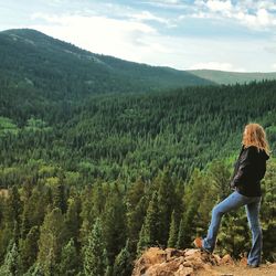 Rear view of woman looking at mountains