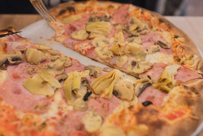 Close-up of pizza served on table