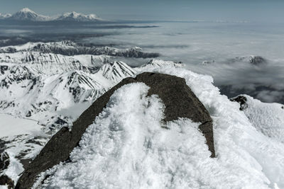 Scenic view of snow covered mountains against sky