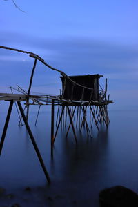 Lifeguard hut against blue sky at dusk