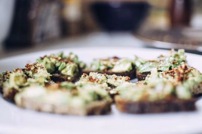 Close-up of avocado toasts served in plate