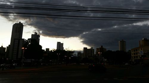 Buildings against cloudy sky