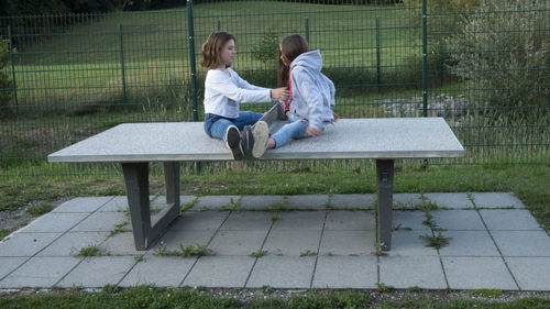 People sitting on bench in park