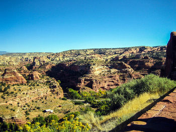 Scenic view of mountains against clear blue sky