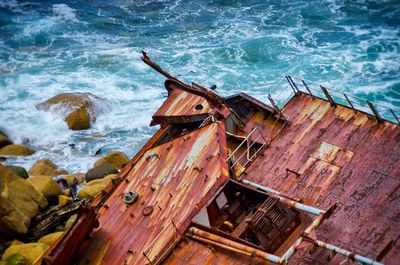 High angle view of rusted deck at sea shore