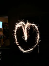 Close-up of illuminated heart shape at night