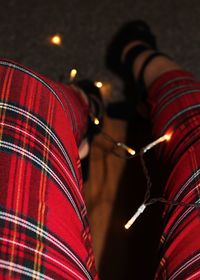 Close-up of illuminated lighting equipment at night