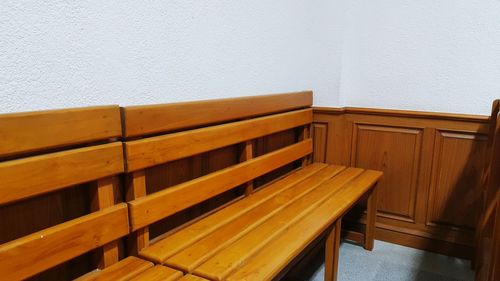 Empty chairs and table against wall at home