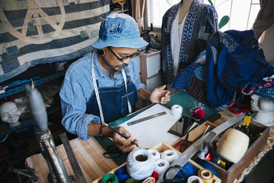 High angle view of man working on table