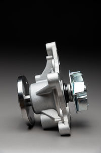 Close-up of machinery against black background