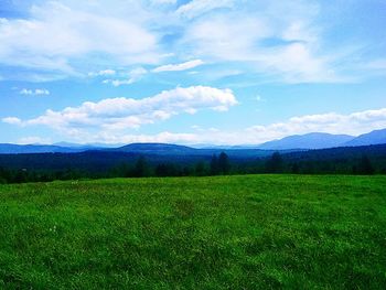 Scenic view of landscape against cloudy sky