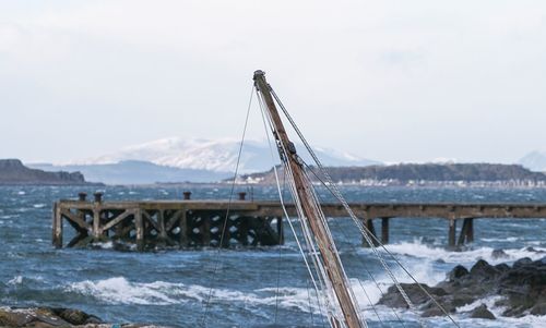 Bridge over sea against sky