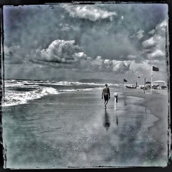 Scenic view of sea against cloudy sky