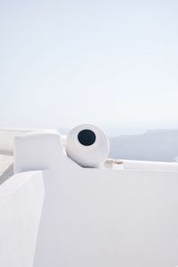 Whitewashed building against clear sky