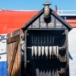 Smoked fish hanging at market stall