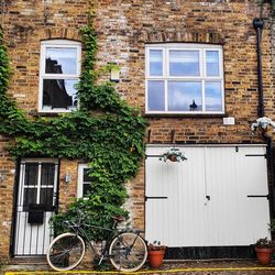 Bicycle against wall of building